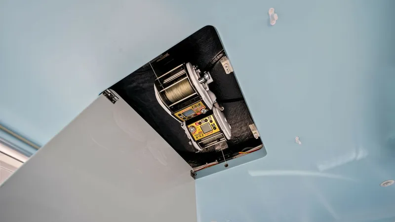 Slide: The Image of Recessed Electric Teaser Reels This image showcases the recessed electric teaser reels on the Viking 54 Convertible, Pipe Dream. The sleek design integrates seamlessly into the ceiling, offering a clean and efficient setup for sportfishing enthusiasts. The high-quality construction ens - 8673322