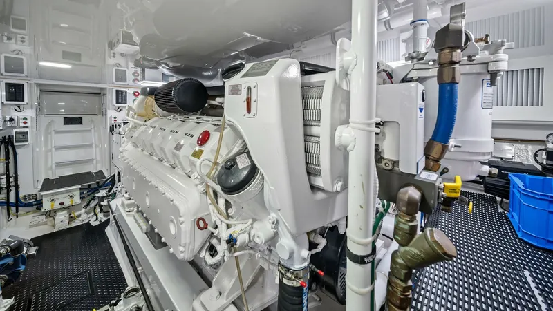 Slide: The Image of Engine Room with Advanced Machinery This image showcases the immaculate engine room of the 2021 Viking 54 Convertible, Pipe Dream. The space is equipped with cutting-edge machinery, including a powerful engine, ensuring optimal performance. The room's pristine, well-organized layout and hig - 8673346