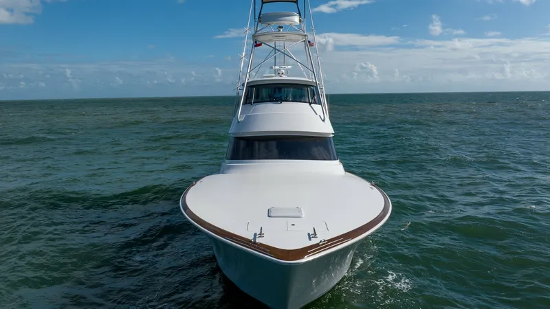 Slide: The Image of Bow View with Tower The sleek bow of the 2019 Viking 68 Enclosed Bridge, Sandman, is showcased in this image. The vessel's elegant lines and robust construction are complemented by the striking tower, offering excellent visibility for navigation. The expansive foredeck and p - 8738086
