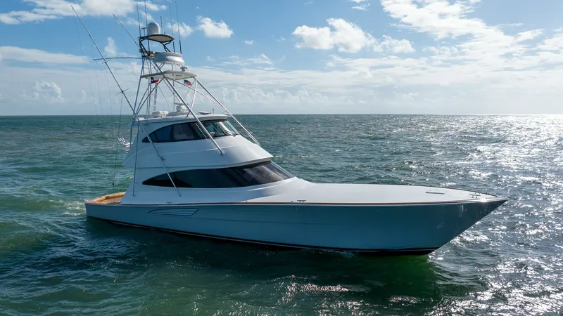 Slide: The Image of Side Profile of Viking 68 Enclosed Bridge The 2019 Viking 68 Enclosed Bridge 'Sandman' showcases a sleek and powerful side profile, emphasizing its aerodynamic design and advanced hull structure. The enclosed bridge offers enhanced visibility and protection, making it ideal for extended voyages. - 8738084