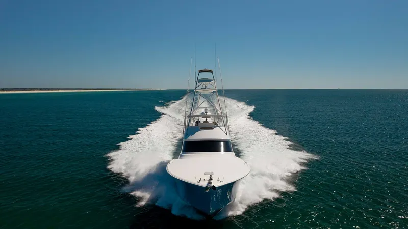 Slide: The Image of Viking 68 Convertible Bow View This dynamic image captures the powerful bow of the 2019 Viking 68 Convertible, 'Gas Money', slicing through the water with precision. The sleek hull design is complemented by the towering flybridge, showcasing the vessel's impressive stature and performa - 8679311