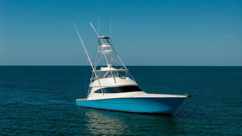 Slide: The Image of Bow View with Tower The Viking 68 Convertible 'Gas Money' showcases a sleek bow view, highlighting its elegant hull design and striking blue finish. The tall tower provides excellent visibility for navigation and sport fishing, enhancing the vessel's performance capabilities - 8679307