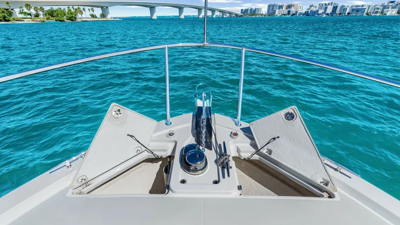 Slide: The Image of Foredeck Anchor and Storage Area The foredeck of the 2022 Back Cove 390 features a well-organized anchor and storage area, designed for both functionality and style. Stainless steel fittings and a polished anchor housing provide durability and a sleek look, while the built-in storage com - 8738156