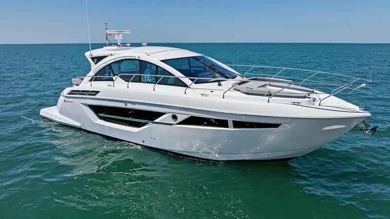 The Image of Starboard Profile of 2024 Cruisers 50 Cantius This stunning side view of the 2024 Cruisers Yachts 50 Cantius showcases its sleek and modern design. The aerodynamic lines and expansive windows provide both style and panoramic views. The spacious deck is perfect for relaxation, while the sophisticated - 8737980