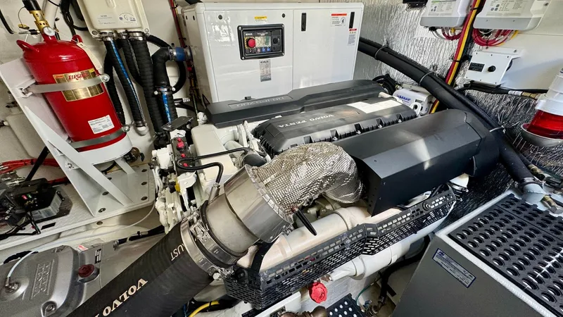 Slide: The Image of Engine Room with Volvo Penta System This image showcases the well-organized engine room of the 2024 Cruisers Yachts 50 Cantius, featuring a powerful Volvo Penta system. The space is meticulously arranged with easy access to components, complemented by advanced electrical systems and a fire - 8738003