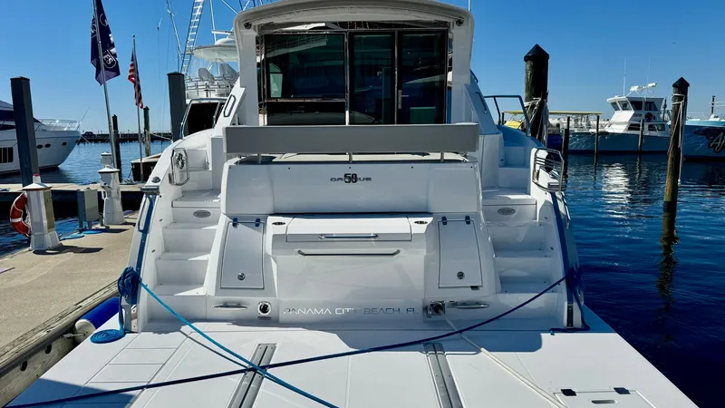 Slide: The Image of Spacious Aft Deck with Swim Platform The 2024 Cruisers Yachts 50 Cantius showcases a spacious aft deck with a sleek swim platform, perfect for water activities. The clean, modern design features integrated steps and ample storage, enhancing usability and convenience. This area provides easy - 8738007