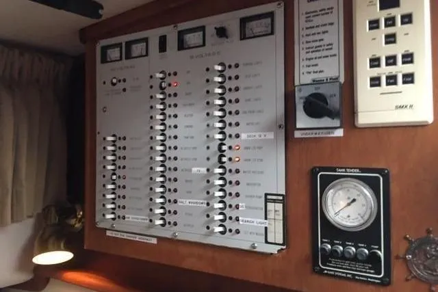 Slide: The Image of Electrical control panel inside a 1997 Fortier Hardtop Express boat. - 31