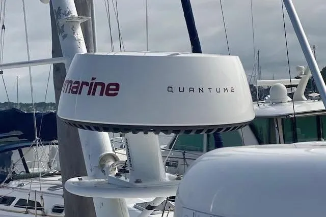 Slide: The Image of Radar equipment on a 1997 Fortier Hardtop Express boat, featuring Quantum 2 technology. - 33