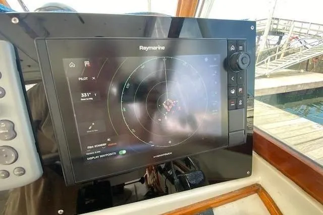 Slide: The Image of Raymarine navigation system on 1997 Fortier Hardtop Express boat, dockside view. - 36