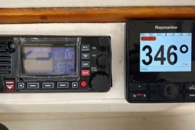 Slide: The Image of Navigation instruments on a 1997 Fortier Hardtop Express boat dashboard, displaying a 346-degree heading. - 37