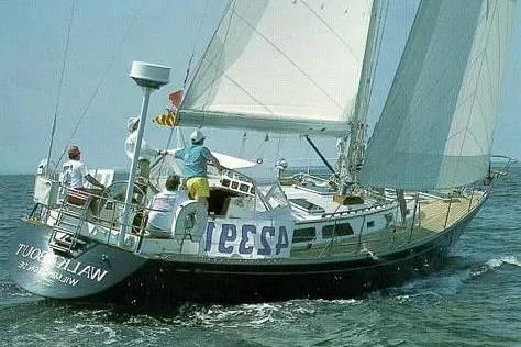 Slide: The Image of Sailing yacht Alden 46 from 1988 on open water with crew onboard. - 3