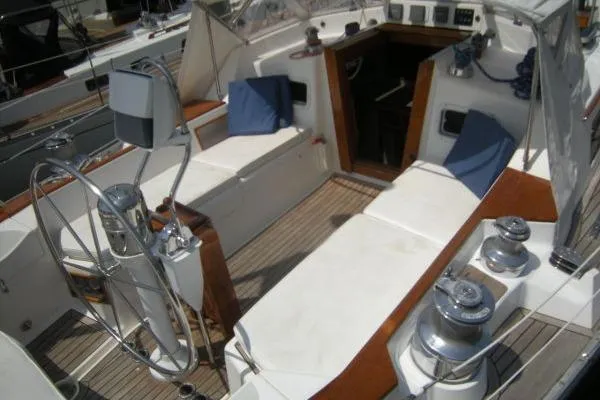 Slide: The Image of Cockpit of 1988 Alden 46 sailboat with wooden accents and steering wheel. - 6