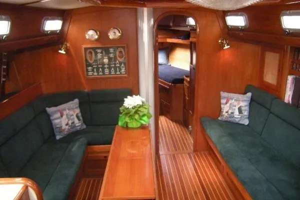 Slide: The Image of Luxurious 1988 Alden 46 yacht interior with wooden finish and plush seating. - 7