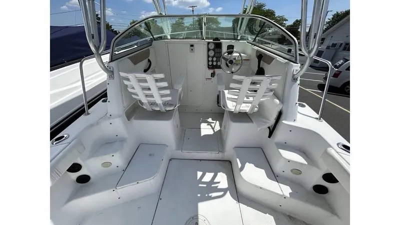 Slide: The Image of 2005 Seaswirl Striper 2301 Dual Console O/B boat interior with seating and controls. - 5
