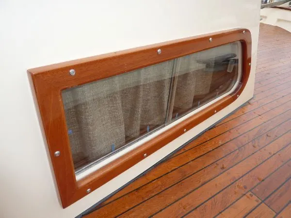 Slide: The Image of Wood-framed window on 1968 Monk 56 Flushdeck yacht with teak deck. - 23