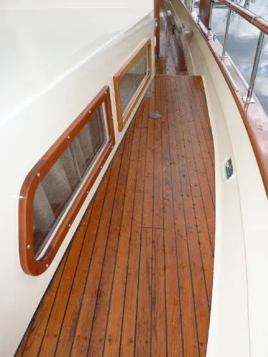 Slide: The Image of 1968 Monk 56 Flushdeck yacht with polished wooden deck and windows. - 28