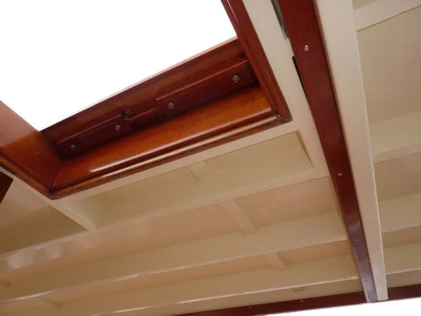 Slide: The Image of 1968 Monk 56 Flushdeck yacht interior ceiling with wooden trim and open hatch. - 32