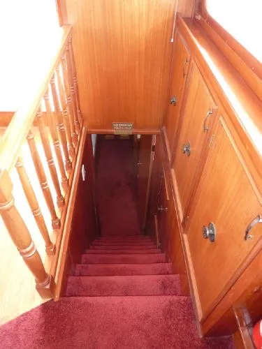 Slide: The Image of Wooden staircase with red carpet in 1968 Monk 56 Flushdeck yacht interior. - 43