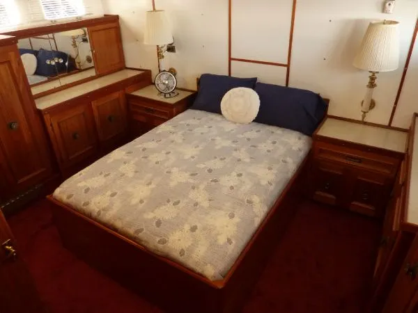Slide: The Image of Cozy bedroom with wooden furniture on a 1968 Monk 56 Flushdeck yacht. - 44