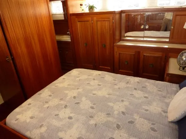 Slide: The Image of Cozy bedroom with wooden cabinets in a 1968 Monk 56 Flushdeck yacht. - 46