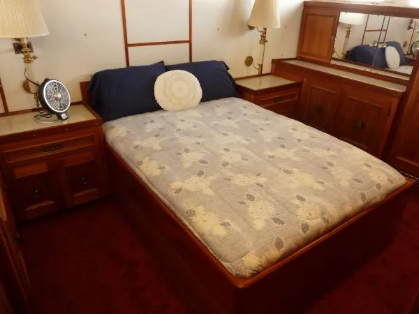Slide: The Image of Cozy bedroom with wooden furniture in a 1968 Monk 56 Flushdeck yacht. - 49