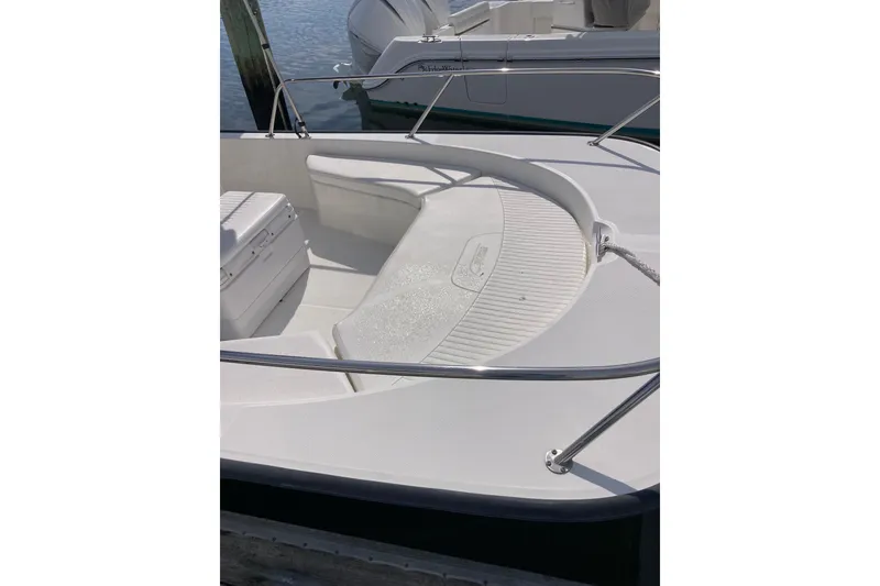 Slide: The Image of 2011 Boston Whaler 190 Montauk boat interior with seating and railings. - 15