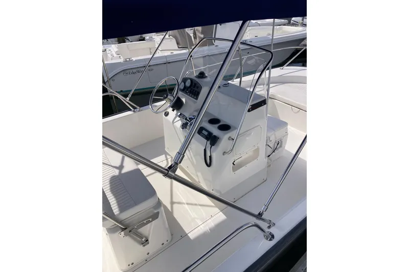 Slide: The Image of 2011 Boston Whaler 190 Montauk boat interior with steering console and seating. - 17