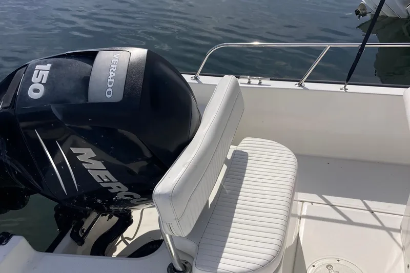 Slide: The Image of 2011 Boston Whaler 190 Montauk boat with Mercury Verado 150 engine on calm water. - 5