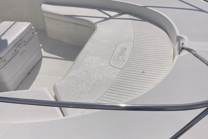 Slide: The Image of 2011 Boston Whaler 190 Montauk boat interior with seating and cooler. - 7