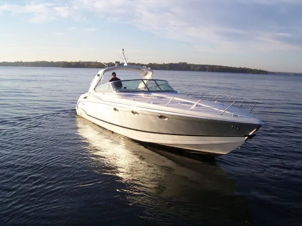 Slide: The Image of 2006 Formula 400 Super Sport boat on calm water. - 11