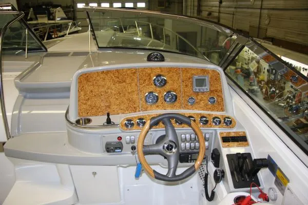 Slide: The Image of 2006 Formula 400 Super Sport boat dashboard with wood accents. - 3