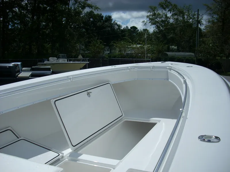 Slide: The Image of 2024 Contender 35 ST STEP HULL boat with open storage compartments. - 5