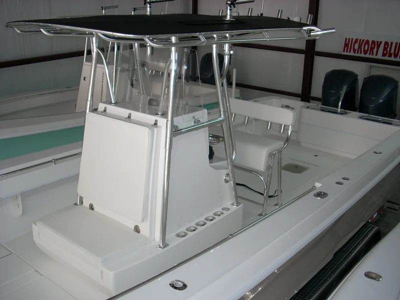 Slide: The Image of 2024 Contender 35 ST STEP HULL boat interior with seating and console. - 9