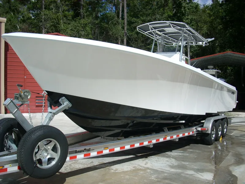 The Image of 2024 Contender 35 ST STEP HULL boat on trailer, ready for transport. - 1