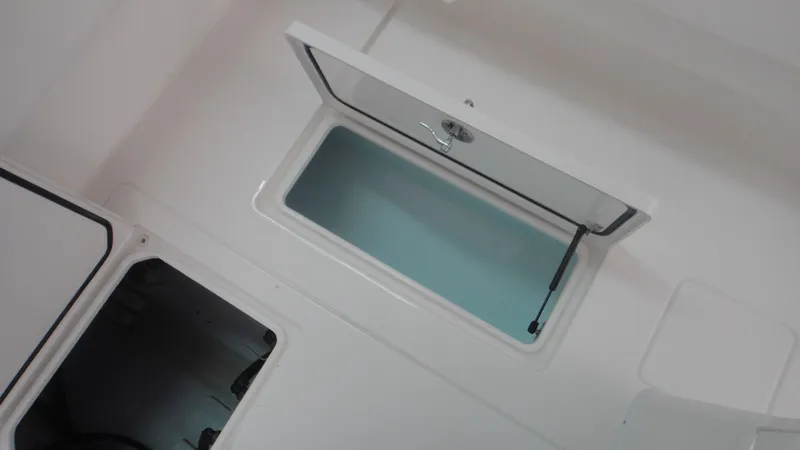 Slide: The Image of Open storage compartments on the 2024 Contender 32 ST boat. - 18