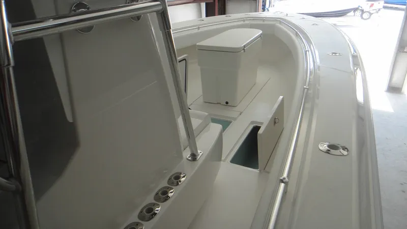 Slide: The Image of 2024 Contender 32 ST boat interior with storage compartments and seating. - 21