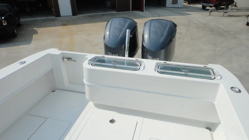 Slide: The Image of 2024 Contender 32 ST boat with dual Yamaha 300 engines and live bait wells. - 5