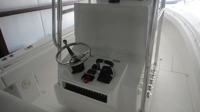 Slide: The Image of 2024 Contender 32 ST boat console with steering wheel and controls. - 8