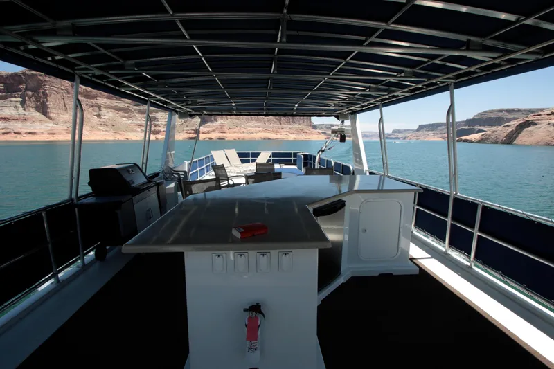 Slide: The Image of Spacious deck of 2006 Sharpe Makena Share 5 houseboat on a scenic lake. - 16
