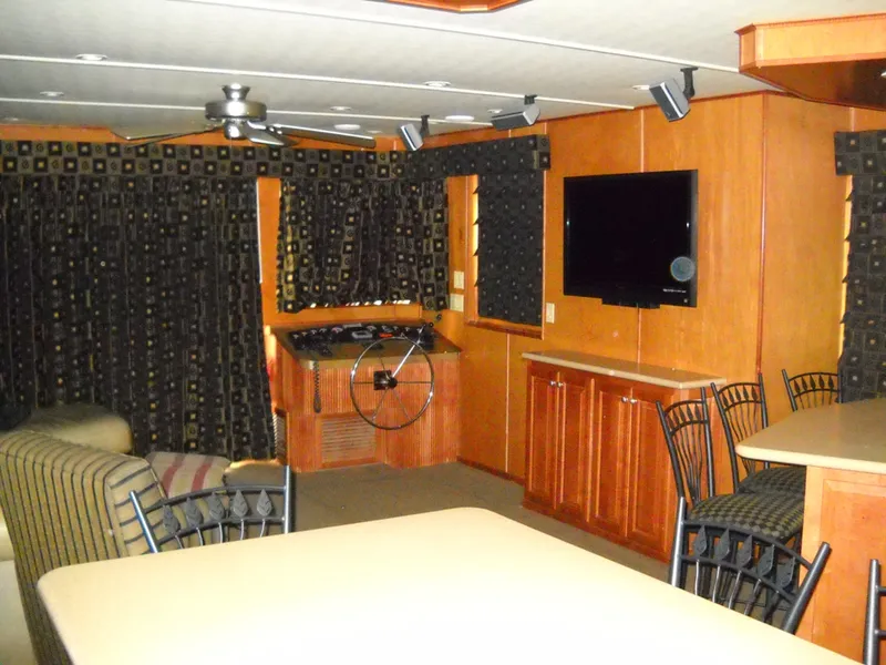 Slide: The Image of 2006 Sharpe Makena Share 5 interior with TV, seating, and wooden cabinetry. - 4