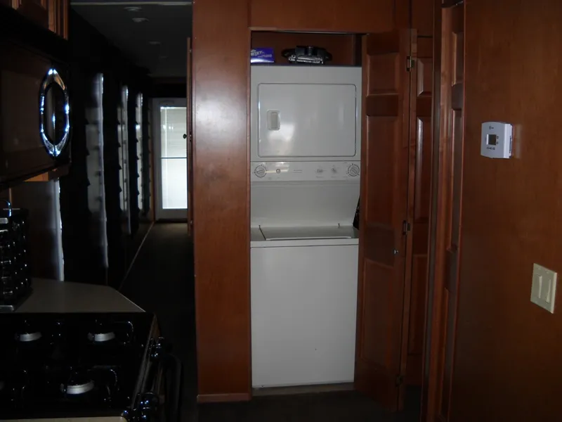 Slide: The Image of Compact laundry area with stacked washer and dryer in a 2006 Sharpe Makena Share 5. - 5