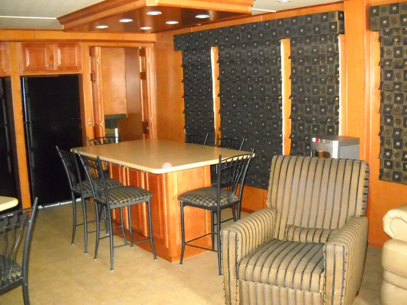 Slide: The Image of Interior of 2006 Sharpe Makena Share 5 with kitchen and seating area. - 8