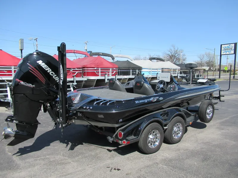 Slide: The Image of 2012 Ranger Z-521 DC boat with Mercury engine, parked on a trailer. - 1
