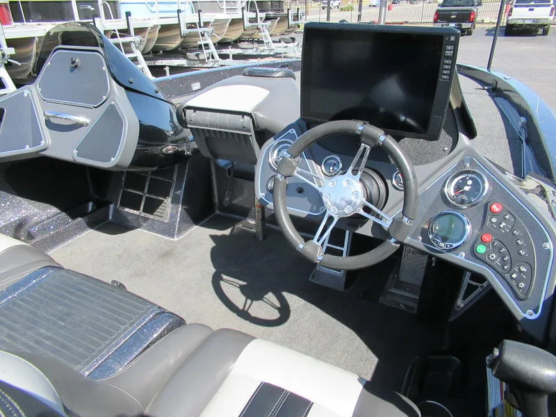 Slide: The Image of 2012 Ranger Z-521 DC boat cockpit with steering wheel and control panel. - 3