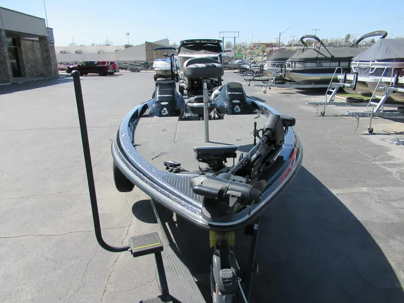 Slide: The Image of 2012 Ranger Z-521 DC boat parked outdoors, showcasing its sleek design and equipment. - 7