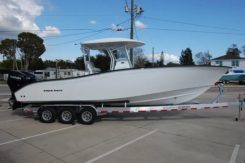 The Image of 2023 Cape Horn 31T boat on a trailer in a parking lot. - 0