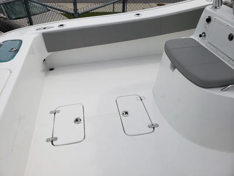Slide: The Image of 2023 Cape Horn 31T boat deck with storage compartments and seating. - 11