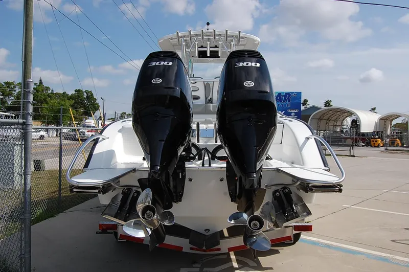 Slide: The Image of 2025 Cape Horn 31T boat with dual 300 horsepower engines, docked outdoors. - 19