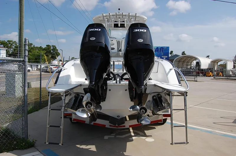 Slide: The Image of 2025 Cape Horn 31T boat with dual 300 horsepower engines, docked outdoors. - 20