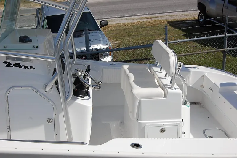 Slide: The Image of 2025 Cape Horn 27 XS boat interior with seating and steering console. - 4